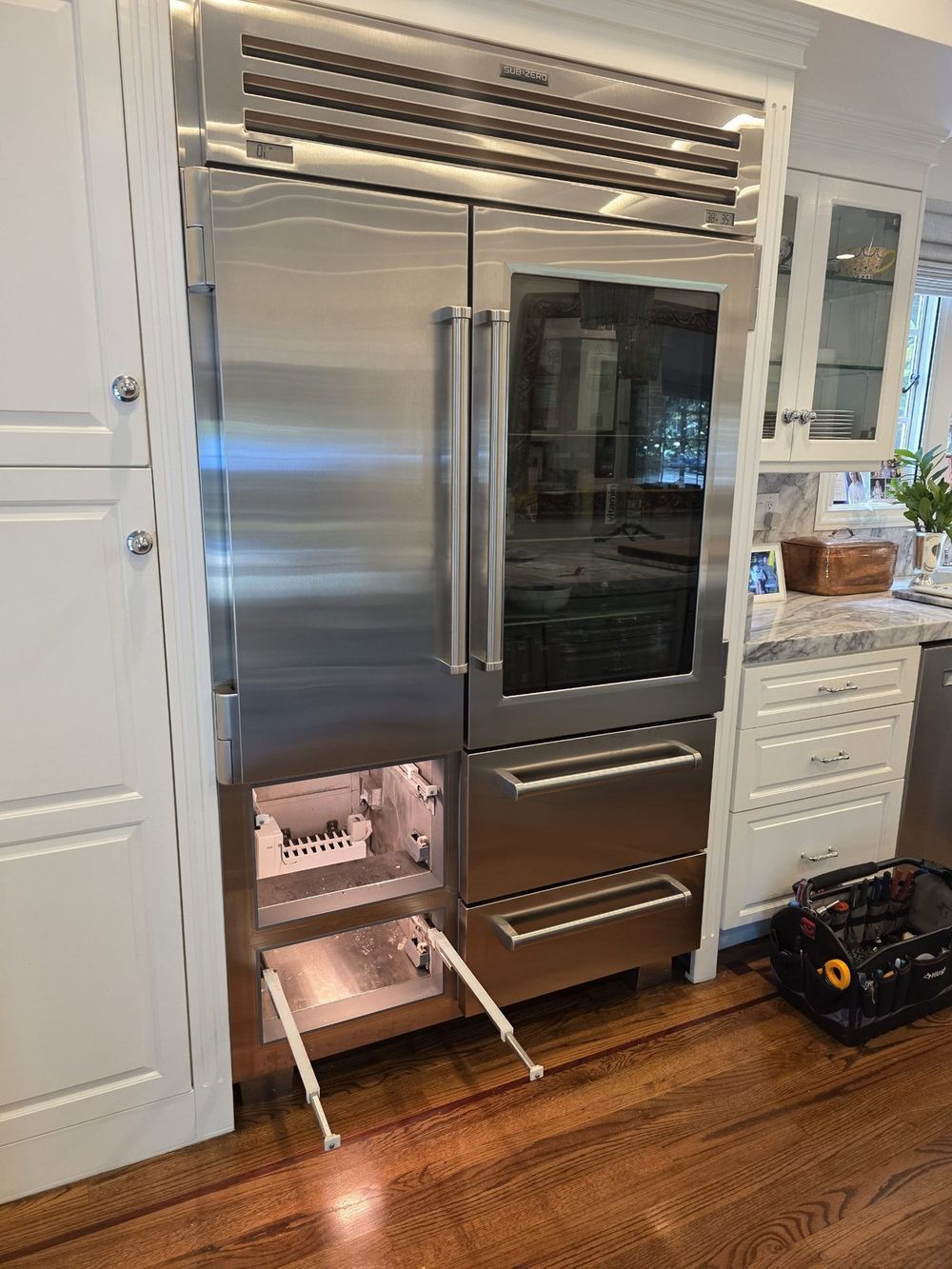 Sub-Zero built-in with drawer modules open during icemaker service