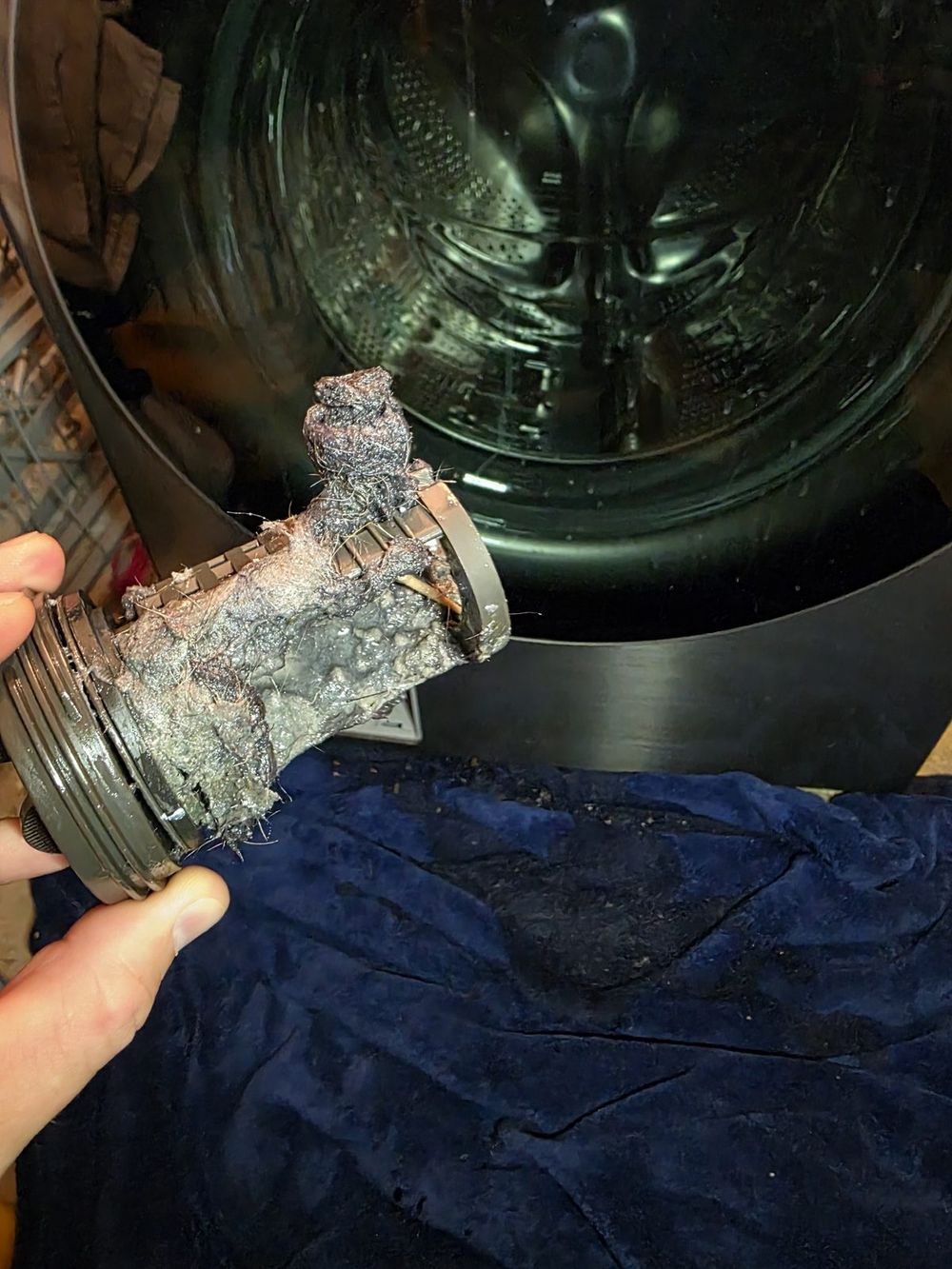Front-load washer drain pump filter clogged during repair