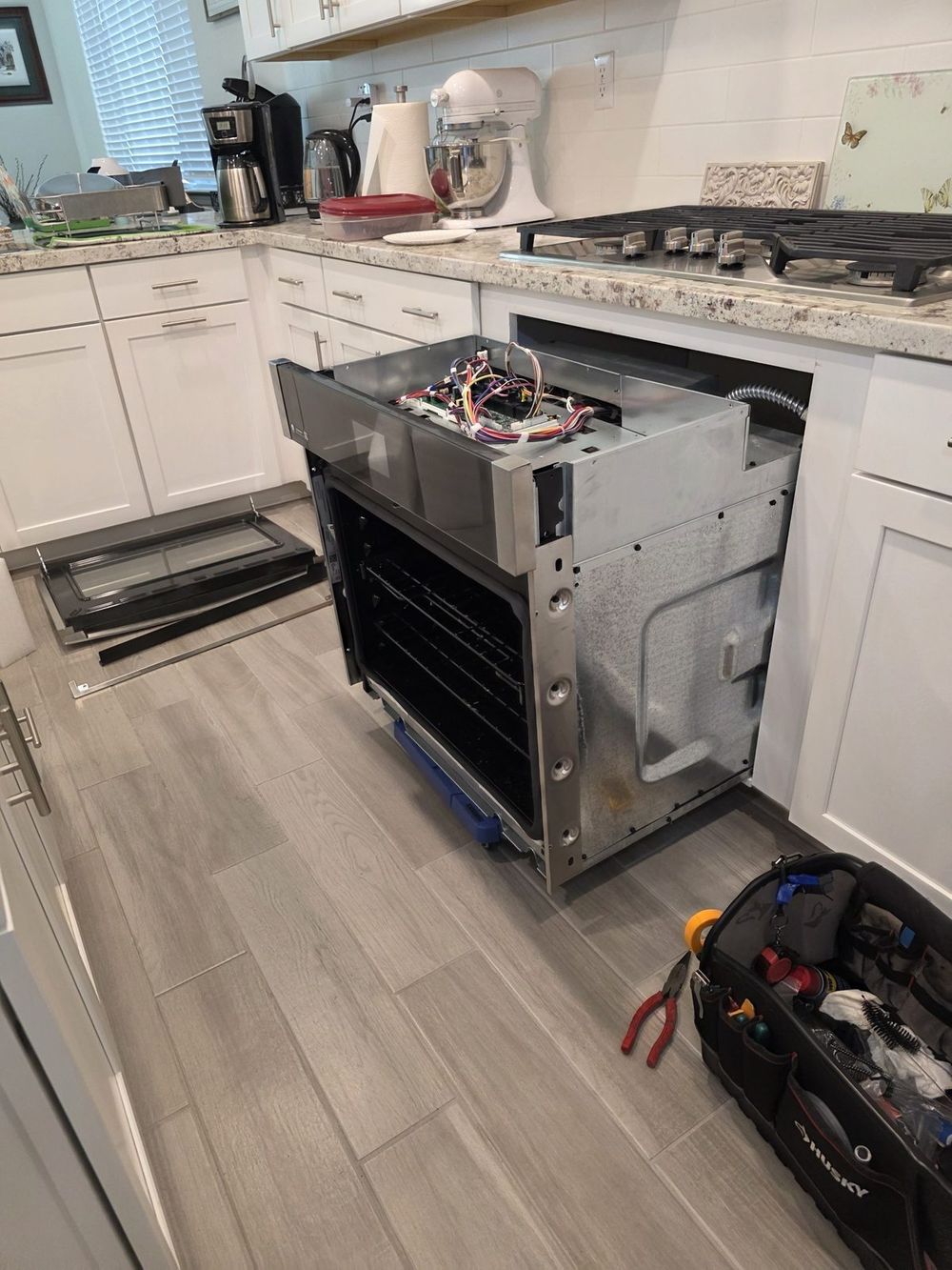 Built-in wall oven pulled for wiring and control repair